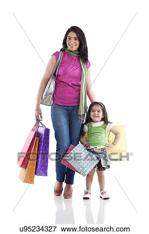 Mother and daughter with shopping bags View Large Photo Image Stock Photo - Mother and daughter with shopping bags . Fotosearch