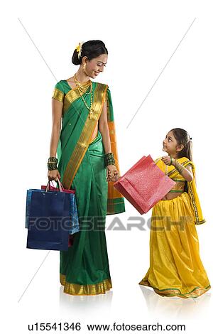 Mother and daughter with shopping bags View Large Photo Image Stock Photograph - Mother and daughter with shopping bags . Fotosearch