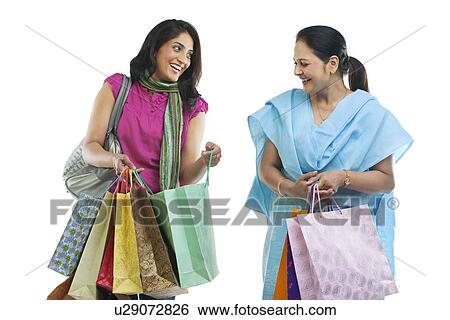 Mother and daughter with shopping bags View Large Photo Image Stock Photograph - Mother and daughter with shopping bags . Fotosearch