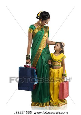 Mother and daughter with shopping bags View Large Photo Image Stock Photography - Mother and daughter with shopping bags . Fotosearch