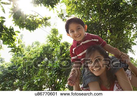 Mother and son having fun View Large Photo Image Stock Image - Mother and son having fun . Fotosearch
