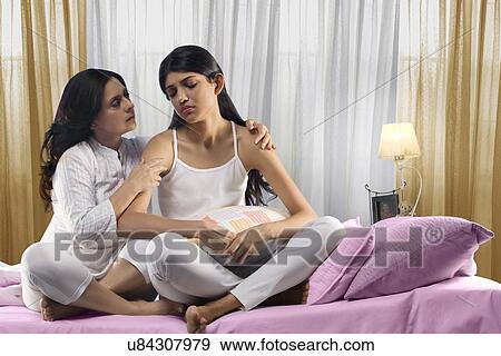 Stock Photo - Mother consoling her daughter . Fotosearch