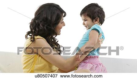 Mother holding her child View Large Photo Image Stock Photo - Mother holding her child . Fotosearch