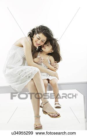 Mother holding her daughter View Large Photo Image Stock Photo - Mother holding her daughter . Fotosearch