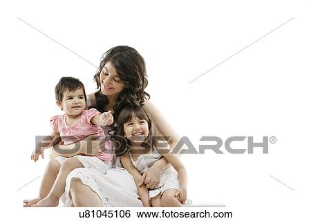 Stock Photograph - Mother holding her kids . Fotosearch