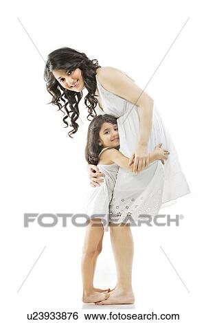 Stock Photograph - Mother hugging her daughter . Fotosearch
