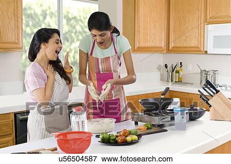 Mother surprised to look at her daughters hands View Large Photo Image Stock Photo - Mother surprised to look at her daughters hands . Fotosearch