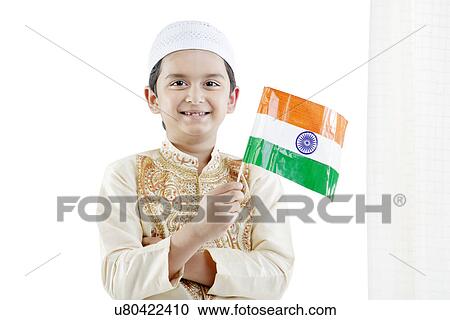 Muslim boy holding the Indian flag View Large Photo Image Stock Image - Muslim boy holding the Indian flag . Fotosearch