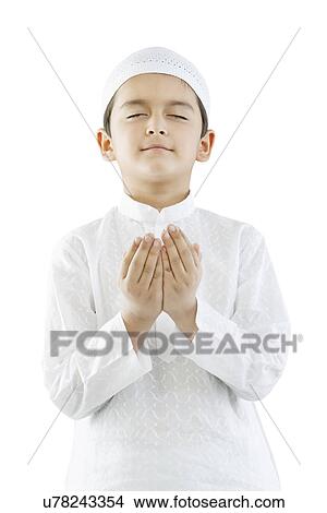 Muslim boy praying View Large Photo Image Picture - Muslim boy praying . Fotosearch