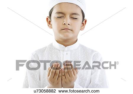 Muslim boy praying View Large Photo Image Stock Image - Muslim boy praying . Fotosearch