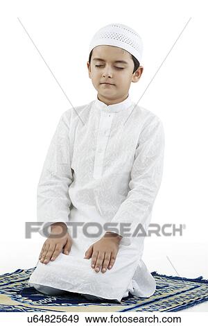 Muslim boy praying View Large Photo Image Stock Photo - Muslim boy praying . Fotosearch