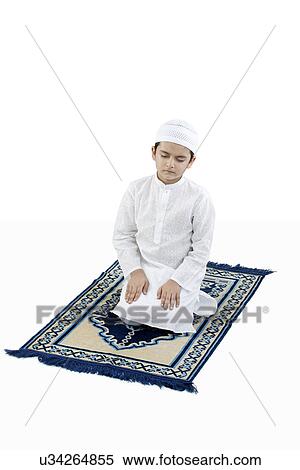 Stock Photography - Muslim boy praying . Fotosearch
