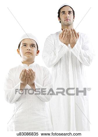Muslim man and his son doing Namaaz View Large Photo Image Stock Photography - Muslim man and his son doing Namaaz . Fotosearch