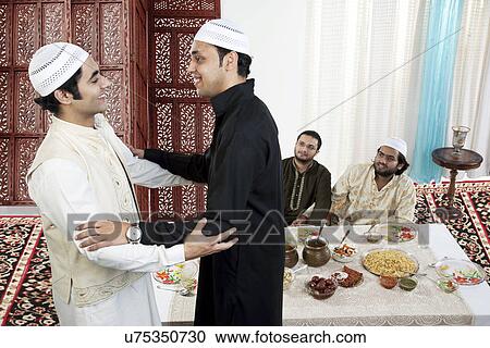 Muslim men greeting each other View Large Photo Image Stock Image - Muslim men greeting each other . Fotosearch