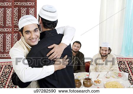 Muslim men hugging each other View Large Photo Image Stock Image - Muslim men hugging each other . Fotosearch