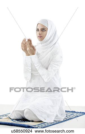 Picture - Muslim woman doing Namaaz . Fotosearch