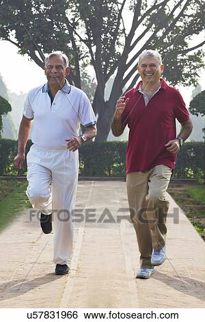 Stock Photograph - Old men jogging in a park . Fotosearch