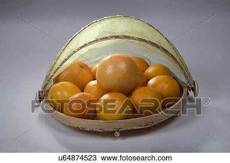 Stock Image - Oranges in a basket . Fotosearch