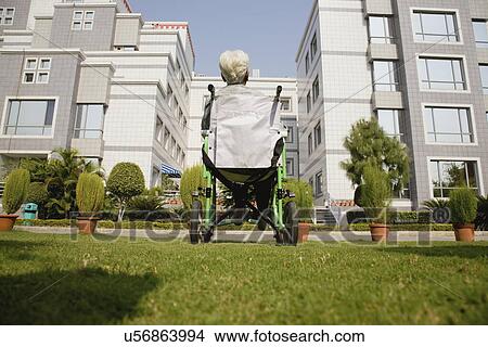 Picture - Patient in a wheelchair . Fotosearch