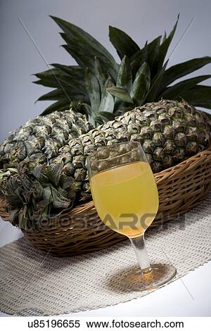 Pineapple juice with pineapples View Large Photo Image Stock Photography - Pineapple juice with pineapples . Fotosearch