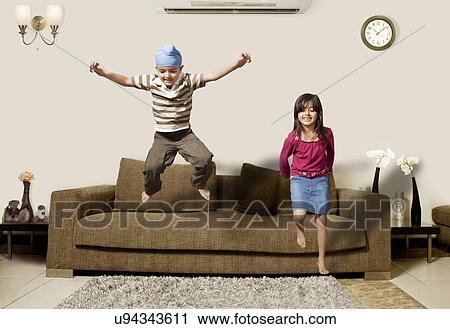 Stock Image - Playful little kids having fun playing at home . Fotosearch