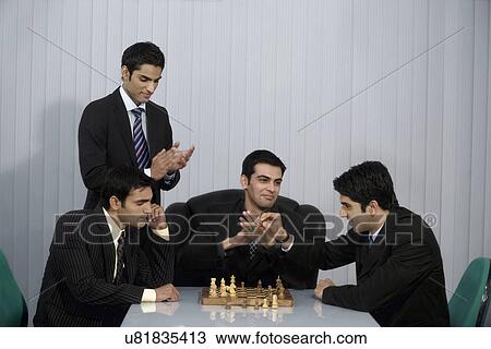 Stock Image - Playing chess . Fotosearch