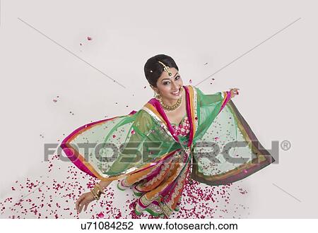 Portrait of a beautiful bride surrounded by rose petals View Large Photo Image Stock Image - Portrait of a beautiful bride surrounded by rose petals. Fotosearch