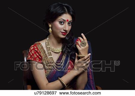Portrait of a beautiful bride with jewelery View Large Photo Image Stock Photo - Portrait of a beautiful bride with jewelery. Fotosearch