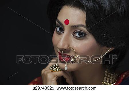 Stock Photography - Portrait of a beautiful bride with jewelery. Fotosearch