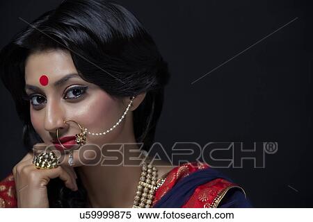 Portrait of a beautiful bride with jewelery View Large Photo Image Stock Photography - Portrait of a beautiful bride with jewelery. Fotosearch