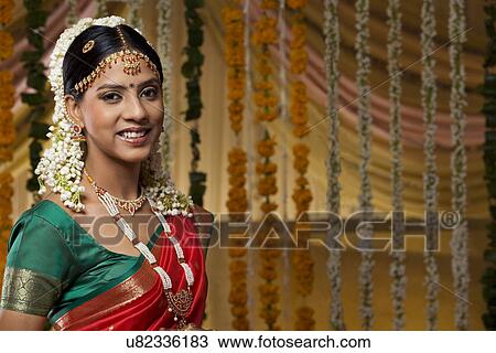 Portrait of a beautiful young bride smiling View Large Photo Image Stock Image - Portrait of a beautiful young bride smiling . Fotosearch