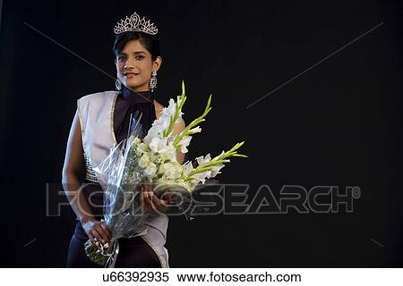 Portrait of a beauty queen with a bouquet View Large Photo Image Stock Photography - Portrait of a beauty queen with a bouquet . Fotosearch