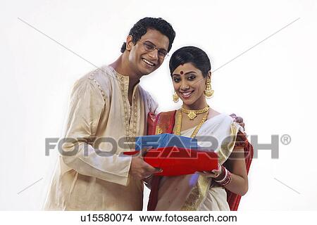 Portrait of a Bengali couple with gifts View Large Photo Image Picture - Portrait of a Bengali couple with gifts . Fotosearch