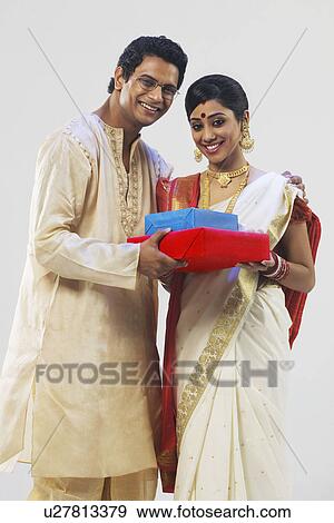 Portrait of a Bengali couple with gifts View Large Photo Image Stock Photo - Portrait of a Bengali couple with gifts . Fotosearch