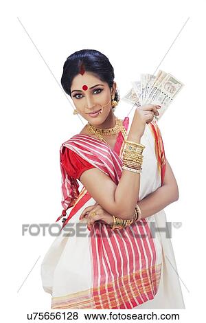Stock Photo - Portrait of a Bengali woman holding currency notes. Fotosearch