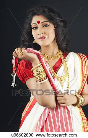 Stock Image - Portrait of a Bengali woman with keys. Fotosearch