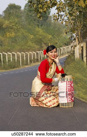 Portrait of a Bihu dancer with a dhol View Large Photo Image Picture - Portrait of a Bihu dancer with a dhol . Fotosearch
