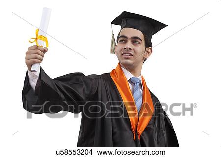 Portrait of a boy at graduation ceremony View Large Photo Image Picture - Portrait of a boy at graduation ceremony. Fotosearch
