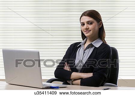 Portrait of a businesswoman in an office View Large Photo Image Stock Photo - Portrait of a businesswoman in an office . Fotosearch