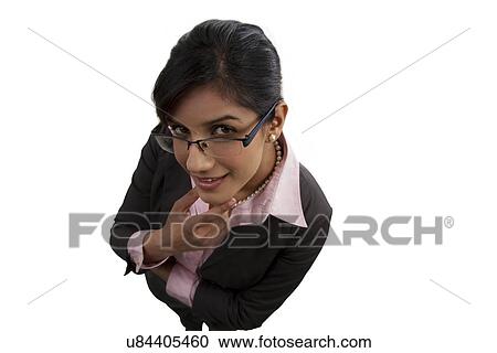 Stock Image - Portrait of a businesswoman thinking . Fotosearch