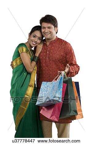 Portrait of a couple with shopping bags View Large Photo Image Stock Photo - Portrait of a couple with shopping bags . Fotosearch