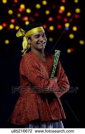 Stock Image - Portrait of a dandiya dancer . Fotosearch