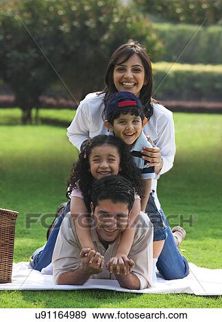 Portrait of a family at a picnic View Large Photo Image Stock Photo - Portrait of a family at a picnic . Fotosearch