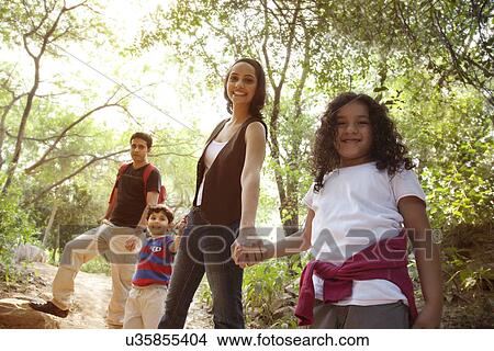 Picture - Portrait of a family in a park . Fotosearch