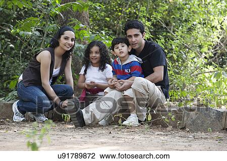 Portrait of a family in a park View Large Photo Image Stock Image - Portrait of a family in a park . Fotosearch
