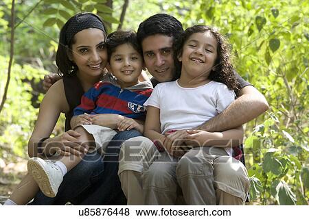 Portrait of a family in a park View Large Photo Image Stock Photo - Portrait of a family in a park . Fotosearch