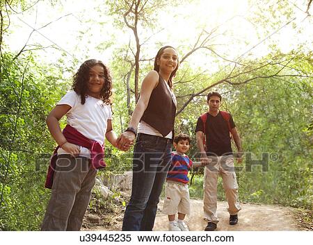 Stock Photography - Portrait of a family in a park . Fotosearch