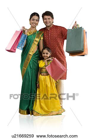 Stock Photo - Portrait of a family with shopping bags . Fotosearch