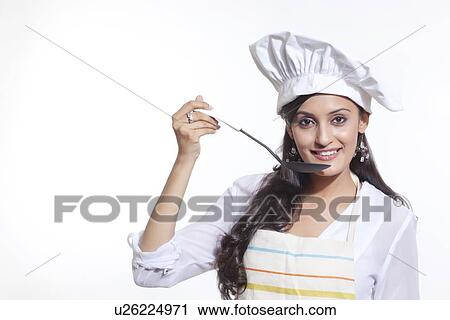Portrait of a female chef tasting View Large Photo Image Stock Image - Portrait of a female chef tasting. Fotosearch