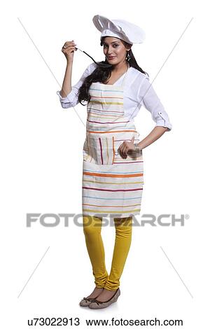 Portrait of a female chef tasting View Large Photo Image Stock Image - Portrait of a female chef tasting. Fotosearch
